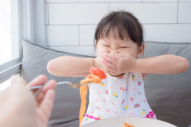 Mealtime battles with children, child refusing to eat their dinner.